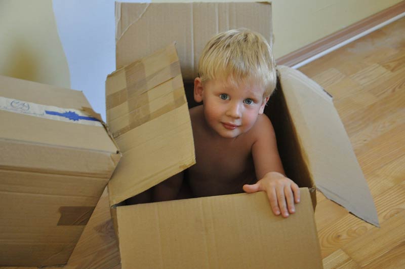 little-boy-playing-in-moving-box-800.jpg